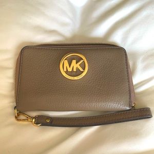 Tan Michael Kors wallet with removable wristlet attachment